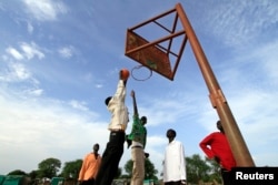 FILE - A basketball team plays a game in the town of Turalei in Warap state, southern Sudan.