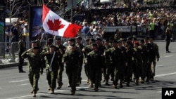 FILE -Canada's soldiers march along main Khreshchatyk Street during a military parade to celebrate Independence Day in Kyiv, Ukraine, Aug. 24, 2018..