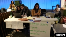 Volunteer immigration attorneys organize to help as people gather to protest against President Donald Trump's executive order travel ban at Los Angeles International Airport, Jan. 31, 2017.