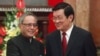 India's President Pranab Mukherjee (L) shakes hands with his Vietnamese counterpart Truong Tan Sang before their meeting at the Presidential Palace in Hanoi, Sept. 15, 2014.