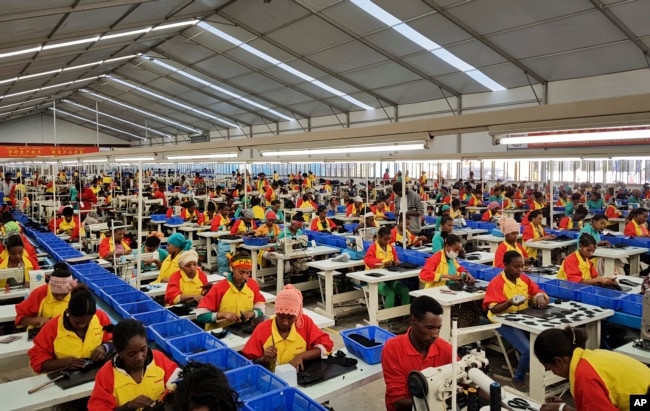 FILE - Ethiopian factory workers make shoes at Chinese company Huajian’s plant in Addis Ababa, Ethiopia, Jan. 5, 2017.