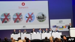 Netherlands -- Members of a joint investigation team present the preliminary results of the criminal investigation into the downing of Malaysia Airlines flight MH17