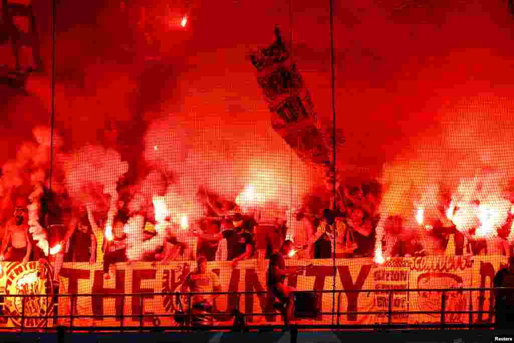 Fans let off flares and display banners before the Club Brugge v Borussia Dortmund Champions League match, Jan Breydel Stadium, Bruges, Belgium.