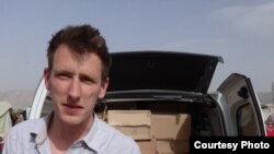 Abdul-Rahman (Peter) Kassig, an American aid worker, making a food delivery to refugees in Lebanon’s Bekaa Valley, May 2013. Kassig is a being held captive by Islamic State militants. (Courtesy of Kassig family)