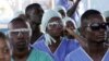 FILE - Medics listens to a speech, attend specialized training in an Ebola treatment unit in Freetown, Dec. 19, 2014