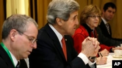 U.S. Secretary of State John Kerry, second from left, meets with leaders of the Syrian Opposition Coalition at the Hotel Excelsior in Rome, February 28, 2013.