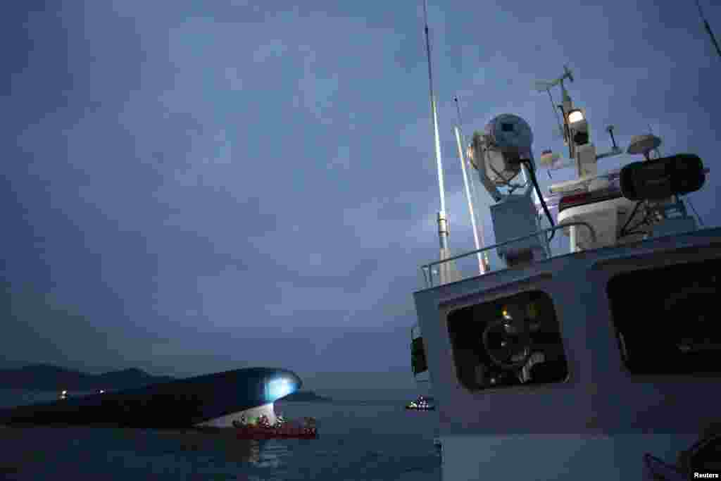 The South Korean ferry "Sewol" is seen sinking in the sea off Jindo, South Korea, April 16, 2014. 