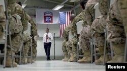 FILE - U.S. Defense Secretary Ash Carter talks to U.S. troops at the Baghdad International Airport in Baghdad, Iraq, in July 2015.