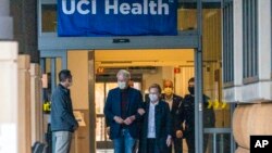 Former President Bill Clinton and former U.S. Secretary of State Hillary Clinton leave the University of California Irvine Medical Center in Orange, Calif., Oct. 17, 2021.