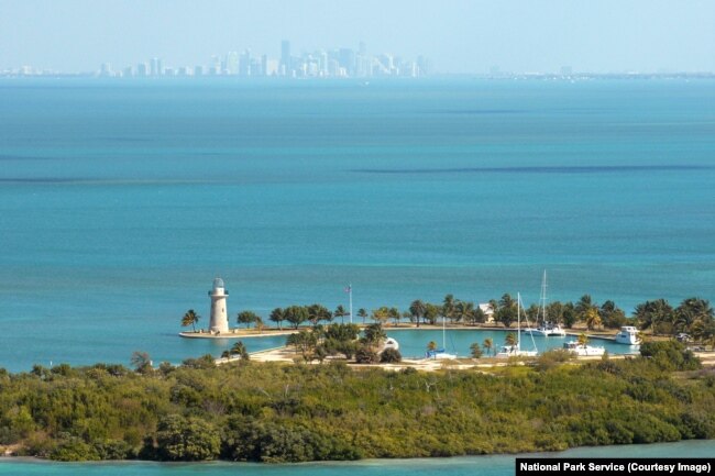 The lighthouse on Boca Chita Key, with a view of the Miami Skyline