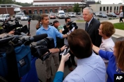 Senator Luther Strange talks with media after voting with his wife, Melissa, Aug. 15, 2017, in Homewood, Ala.