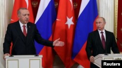 Russian President Vladimir Putin and his Turkish counterpart Recep Tayyip Erdogan attend a news conference after their meeting at the Kremlin in Moscow, Russia, Jan. 23, 2019.