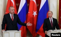 Russian President Vladimir Putin and his Turkish counterpart Recep Tayyip Erdogan attend a news conference after their meeting at the Kremlin in Moscow, Russia, Jan. 23, 2019.