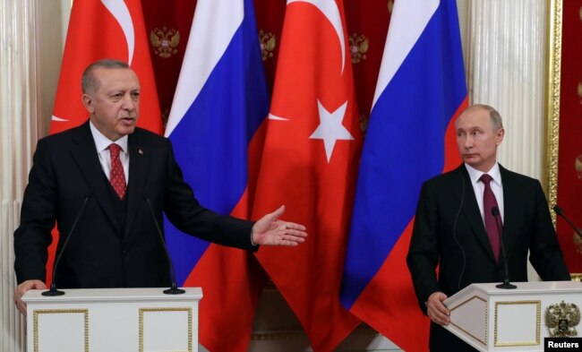 Russian President Vladimir Putin and his Turkish counterpart Recep Tayyip Erdogan attend a news conference after their meeting at the Kremlin in Moscow, Russia, Jan. 23, 2019.