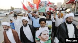 세이크 알리 살만 씨 지지자들의 그의 사진을 들고 시위 행진을 벌이고 있다.(자료사진)
