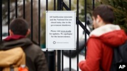 A closed sign is posted on the gate of Smithsonian's National Zoo, Wednesday, Jan. 2, 2019, in Washington. Smithsonian's National Zoo is closed due to the partial government shutdown. 