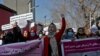 Afghan women shout slogans during a rally to protest against what the protesters say is Taliban restrictions on women, in Kabul, Afghanistan, Dec. 28, 2021. 