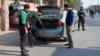 FILE - Police officers check a vehicle in Faisalabad, Jan. 15, 2019. Pakistan counterterrorism police have arrested an al-Qaida leader and close aide to Osama bin Laden after a yearslong manhunt, officials said July 19, 2024.