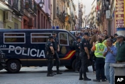 Police patrol at an event to support the Catalonia independence referendum in Madrid, Spain, Sept. 17, 2017.