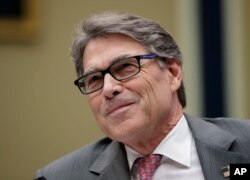 FILE - Energy Secretary Rick Perry listens during a hearing about the electrical grid, on Capitol Hill in Washington, Oct. 12, 2017.