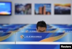 A man is pictured at the media center for the Belt and Road Forum at the National Convention Center in Beijing, May 12, 2017.