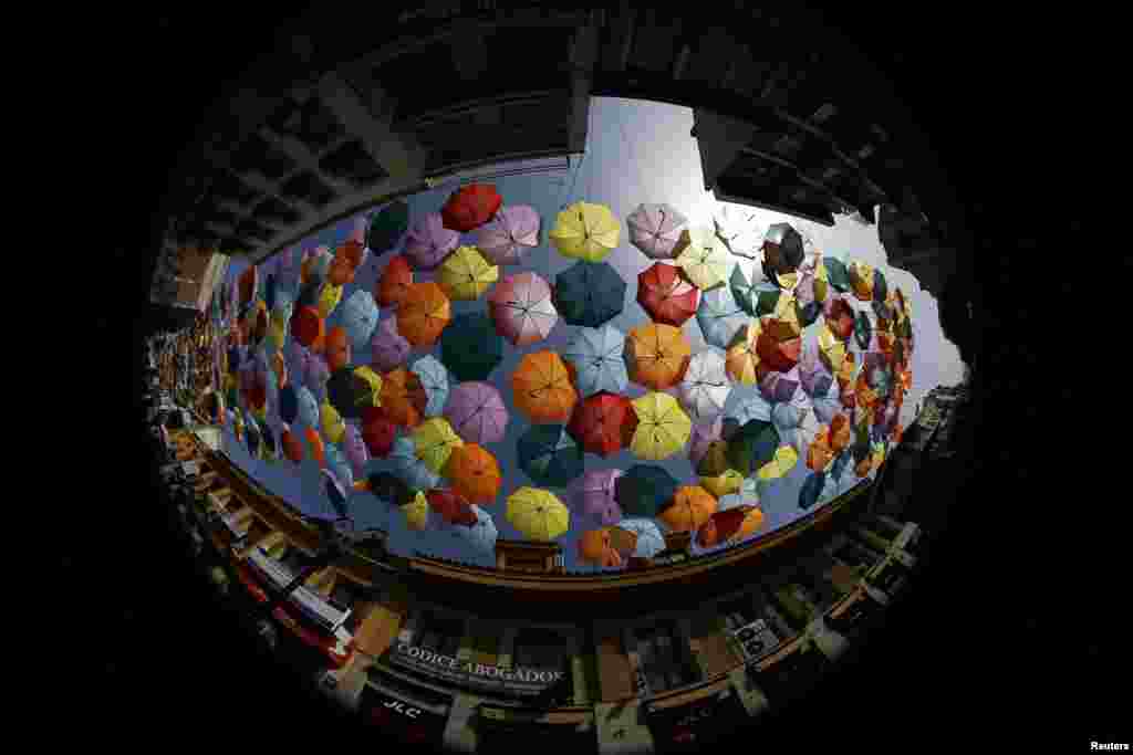 Colorful umbrellas are seen in Getafe, on the outskirts of Madrid,&nbsp; Spain, Aug. 1, 2013. 