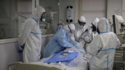 Medics treat a patient with coronavirus at an ICU at the Regional Clinical Hospital 1, in Krasnodar, south Russia, Nov. 2, 2021.