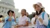 Chinese students from Hangzhou visit the U.S. Capitol in Washington as Congressional leaders try to reach a bipartisan accord to avert a debt-ceiling crisis, Sunday, July 24, 2011. 