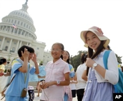 FILE - Chinese students from Hangzhou visit the U.S. Capitol in Washington, July 24, 2011.