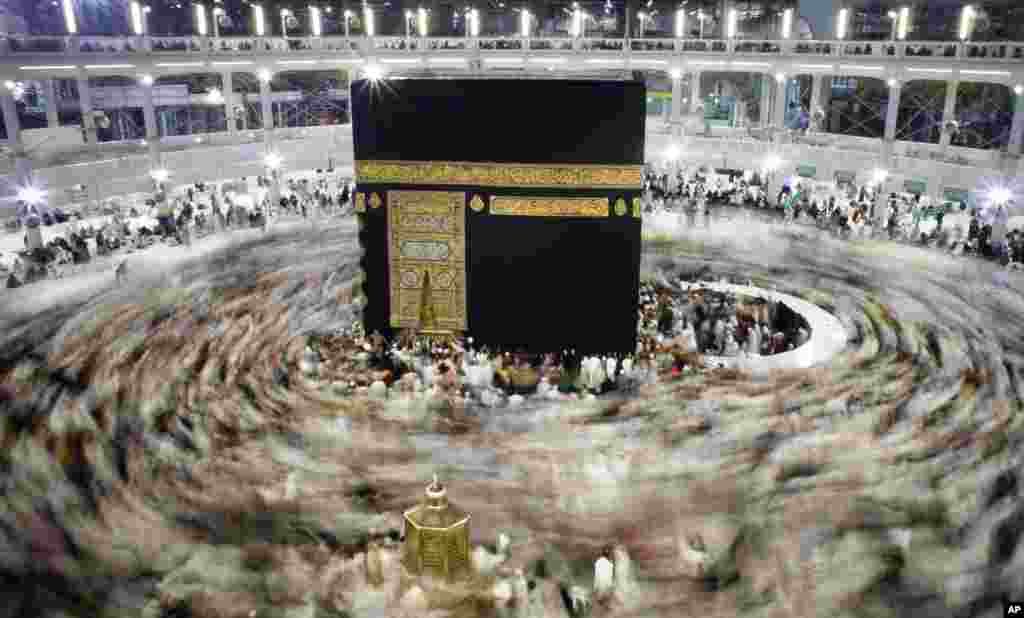 Muslim pilgrims circle the Kaaba, the cubic building at the Grand Mosque in the Muslim holy city of Mecca, Saudi Arabia, during the minor pilgrimage, known as Umrah, Jan. 13, 2016.