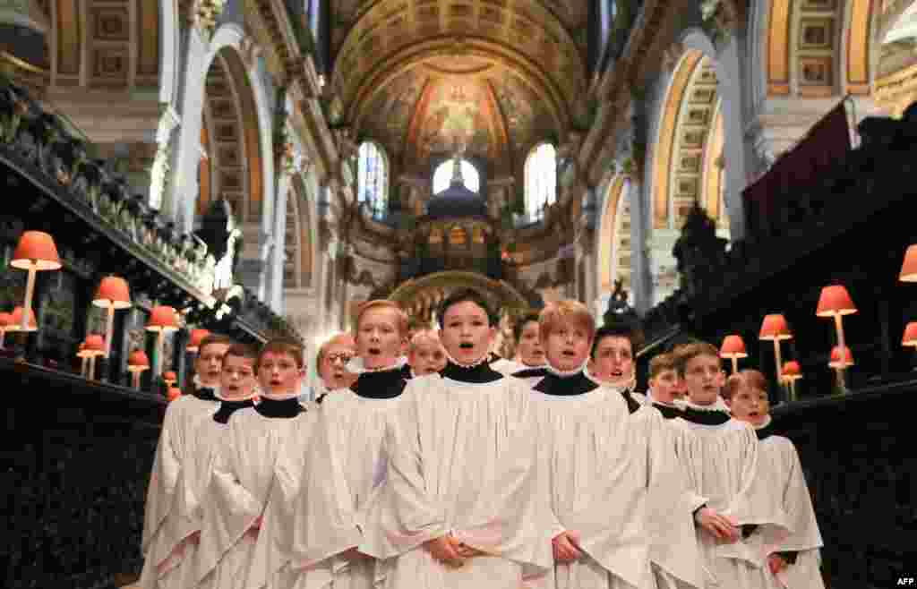 Choir members sing during a rehearsal for their upcoming Christmas performances, at St Paul&#39;s Cathedral in central London.