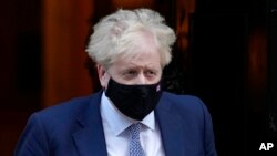 Britain's Prime Minister Boris Johnson leaves Downing Street in London, Jan. 12, 2022.