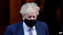 Britain's Prime Minister Boris Johnson leaves Downing Street in London, Jan. 12, 2022.