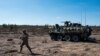 FILE - A U.S. Army soldier and Stryker armored vehicle take part in the "Arrow 16" exercise with the Finnish Army in Niinisalo, Finland, May 4, 2016. U.S. troops are using the Stryker vehicle while offering support near Manbij, Syria, March 6, 2017. 