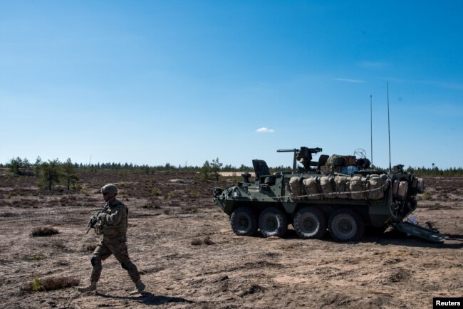 A US army soldier and Stryker armored vehicle take part in the "Arrow 16" exercise with the Finnish Army in Niinisalo, Finland, May 4, 2016. U.S. troops are using the Stryker vehicle while offering support near Manbij, Syria, March 6, 2017.