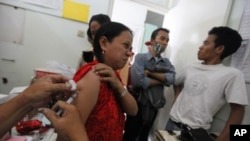 FILE - A tuberculosis patient receives treatment at a clinic in Jakarta, Indonesia.