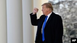 President Donald Trump turns back to the audience after speaking during an event in the Rose Garden at the White House in Washington, Feb. 15, 2019, to declare a national emergency in order to build a wall along the southern border.