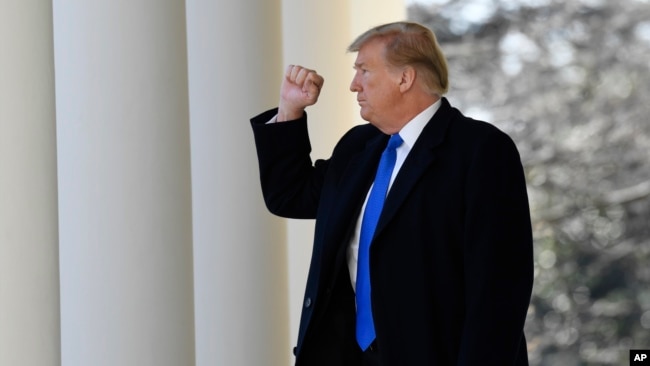 President Donald Trump turns back to the audience after speaking during an event in the Rose Garden at the White House in Washington, Feb. 15, 2019, to declare a national emergency in order to build a wall along the southern border.