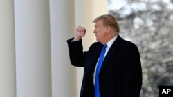 President Donald Trump turns back to the audience after speaking during an event in the Rose Garden at the White House in Washington, Feb. 15, 2019, to declare a national emergency in order to build a wall along the southern border. 