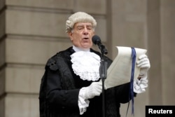 In keeping with traditional practice, Colonel Geoffrey Godbold, the City of London Corporation's Common Cryer and Serjeant-at-Arms reads out the Proclamation of the Summons for a new Parliament on the steps of the Royal Exchange, in the City of London, May 4, 2017.