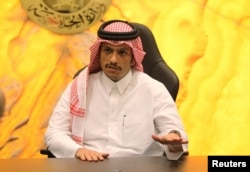 FILE - Qatar's Foreign Minister Sheikh Mohammed bin Abdulrahman al-Thani gestures during an interview in Doha, Nov. 26, 2016.