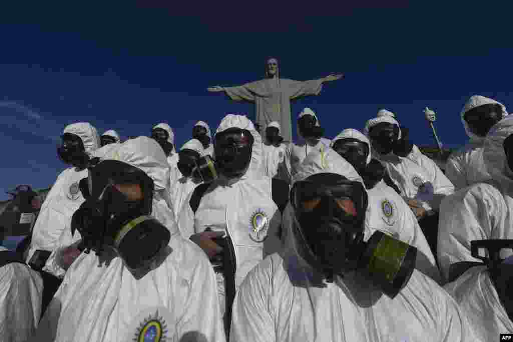 Soldiers of the Brazilian Armed Forces are seen during the disinfection procedures of the Christ The Redeemer statue at the Corcovado mountain prior to the weekend opening of the touristic attraction, in Rio de Janeiro, Brazil.