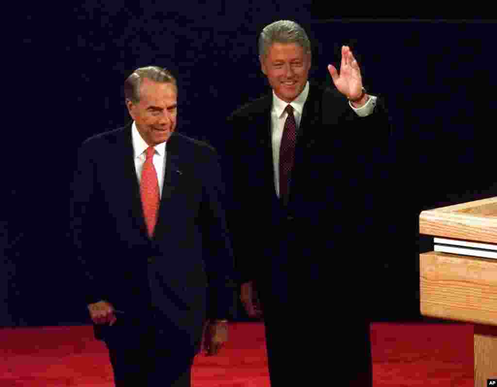 President Clinton and Republican presidential candidate Bob Dole greet that audience just before the beginning of their first presidential debate at the Bushnell Theater in Hartford, Connecticut, Oct. 6, 1996.