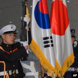 A South Korean military honor guard welcoming Japan's defense minister.