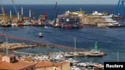 The cruise liner Costa Concordia is seen at the end of the "parbuckling" operation outside Giglio harbor, Italy, Sept. 17, 2013.