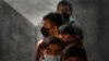  Children wait to receive their COVID-19 vaccination at a government school in New Delhi, India, Jan. 3, 2022.