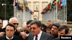 Salim al-Muslat (C) spokesman for the High Negotiations Committee (HNC) and Riad Naasam Agha, member of HNC deliver a statement during the Geneva Peace talks outside the United Nations in Geneva, Switzerland, Feb. 2, 2016. 