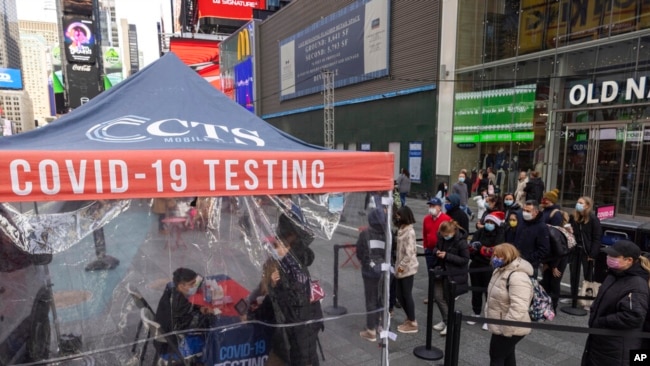 People wait to get tested for COVID-19 at a mobile testing site in Times Square on Dec. 17, 2021, in New York. (AP)