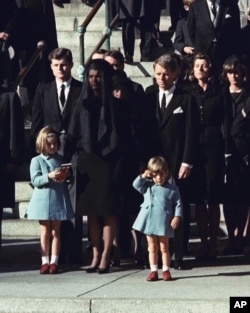 Three-year-old John F. Kennedy Jr. salutes his father's casket in Washington on Nov. 25, 1963. (AP Photo)