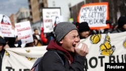 Demonstrators march during the "Day Without Immigrants" protest in Washington, DC, U.S., February 16, 2017.